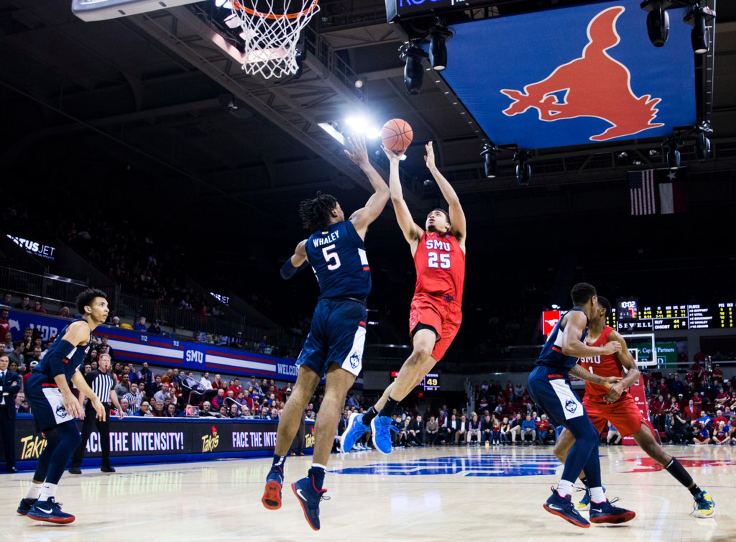 Southern Methodist Mustangs forward Ethan Chargois (25) takes a shot over Connecticut...