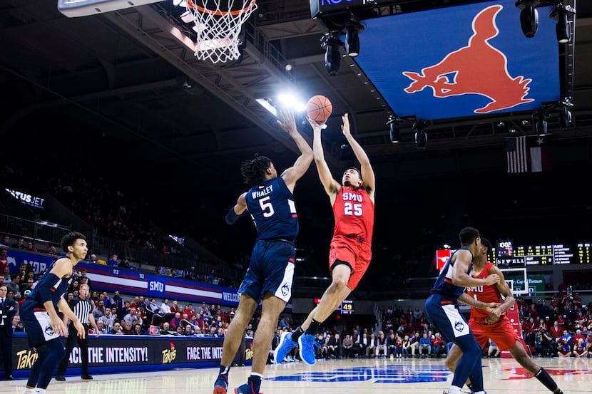 Southern Methodist Mustangs forward Ethan Chargois (25) takes a shot over Connecticut...