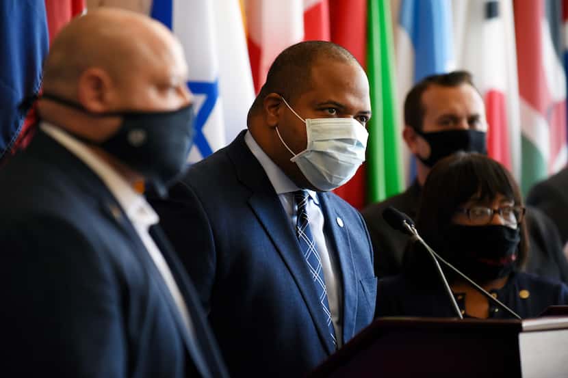 Dallas Mayor Eric Johnson, center, was flanked by members of Dallas City Council at a news...