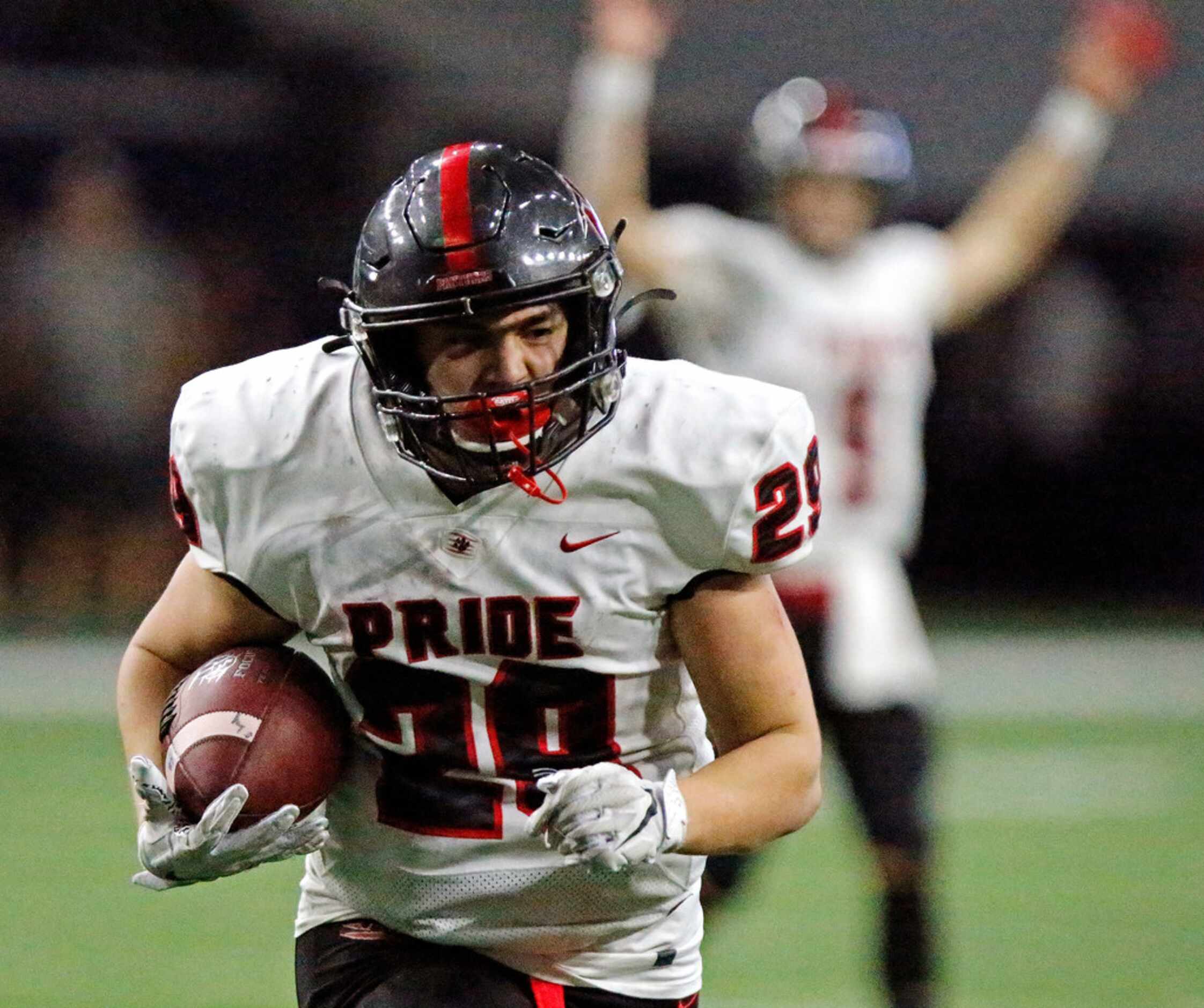 Colleyville Heritage High School running back Braxton Ash (29) gives his team the lead with...