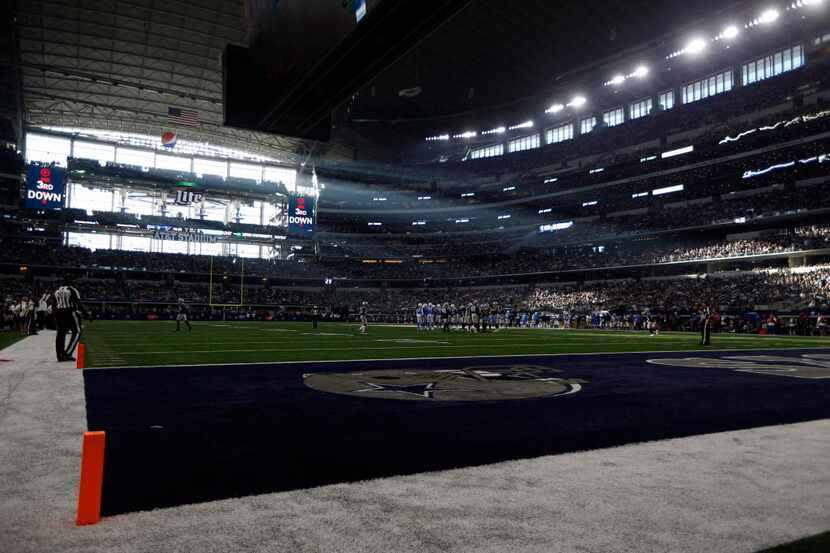 Sun light streams in through the West end zone wall during an NFL football game between the...