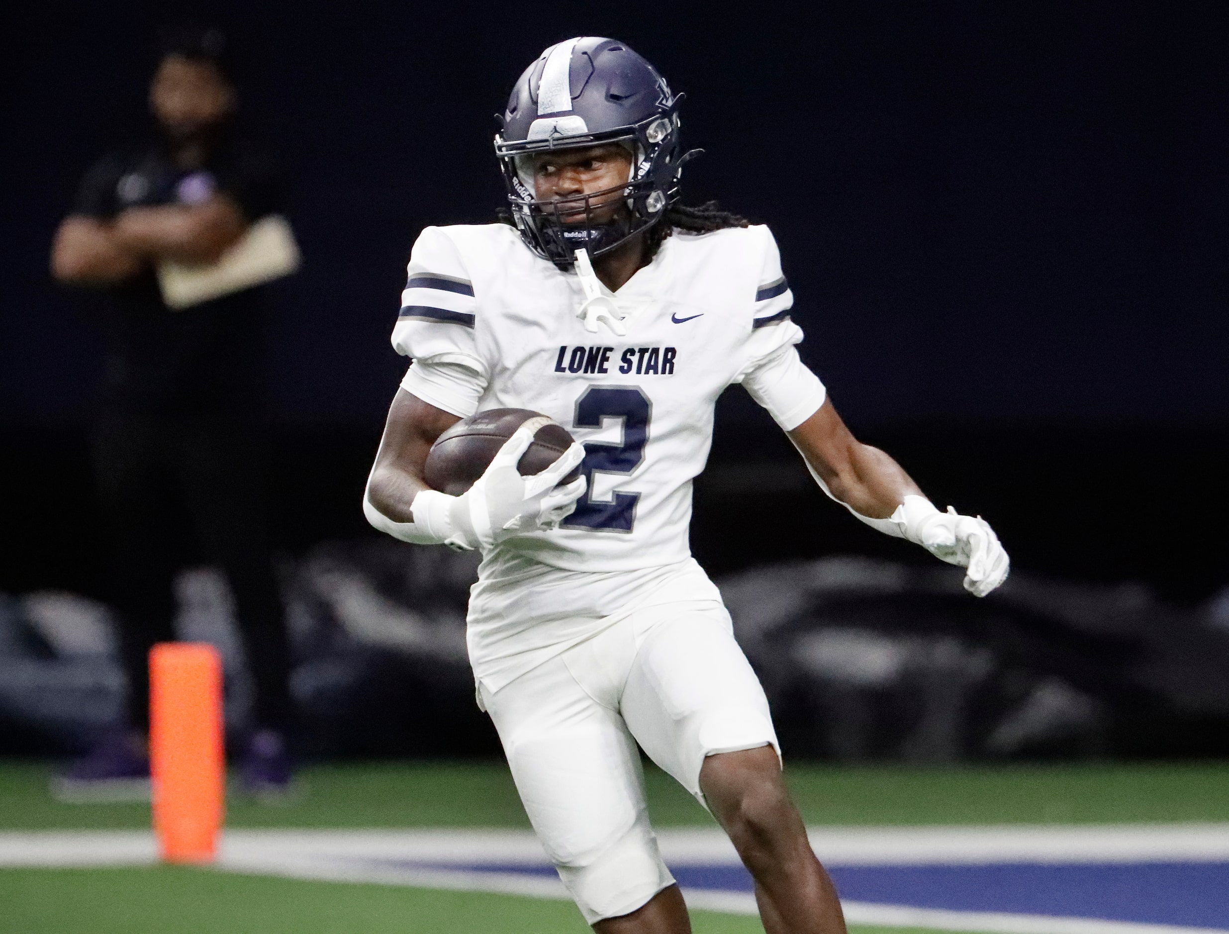 Lone Star High School wide receiver Dekhari Dean (2) returns the opening kickoff as Wakeland...