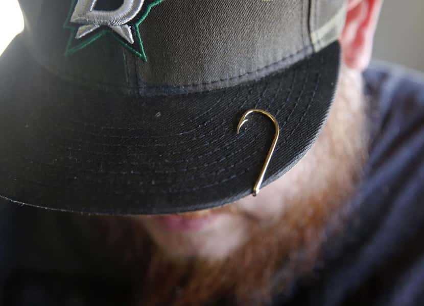 
Brian Clark sports a fishhook on the brim of his cap. Clark bought Fisherman’s Supply near...