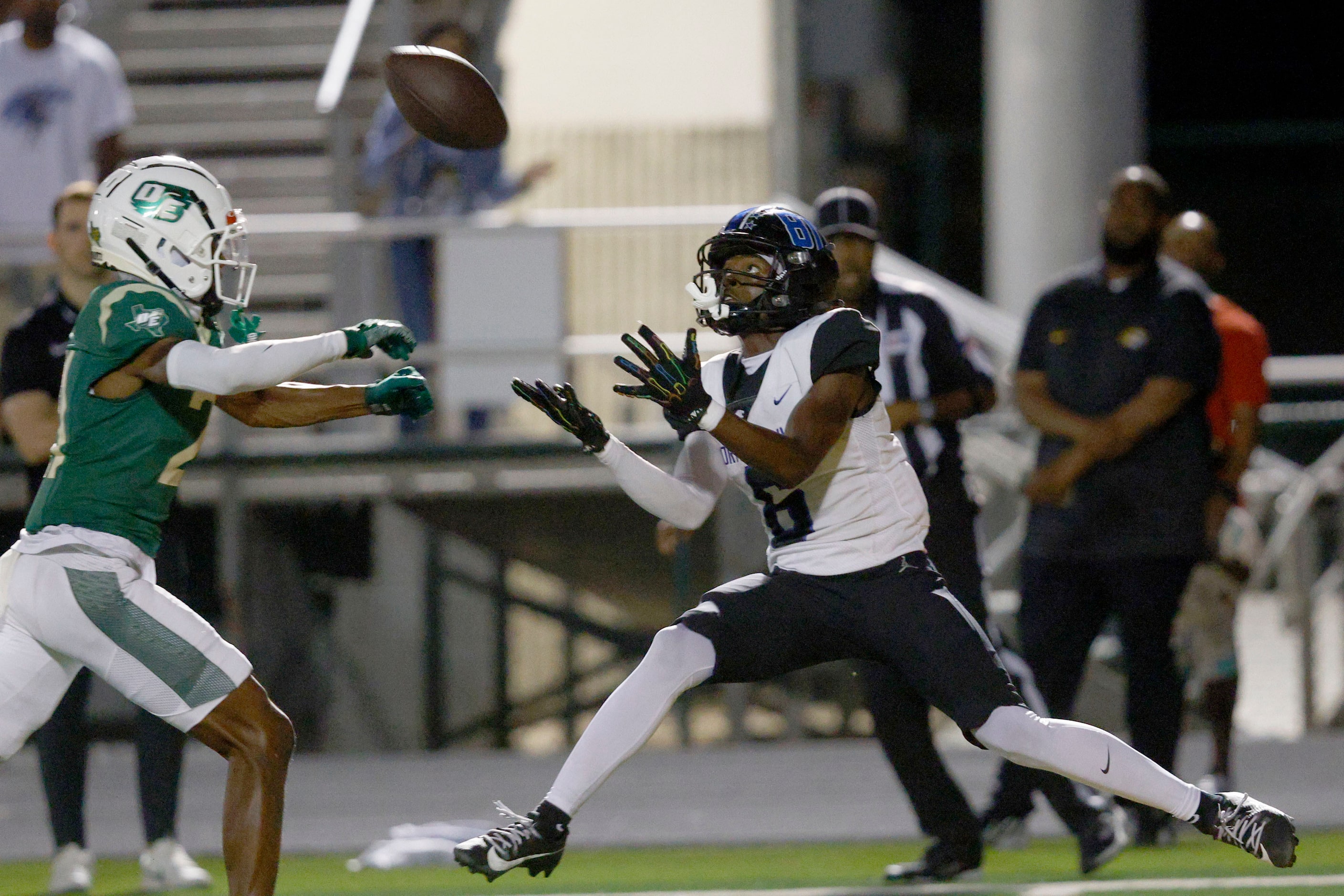 North Crowley's Quentin Gibson catches a pass against DeSoto's Jordan Stevens (21) and...