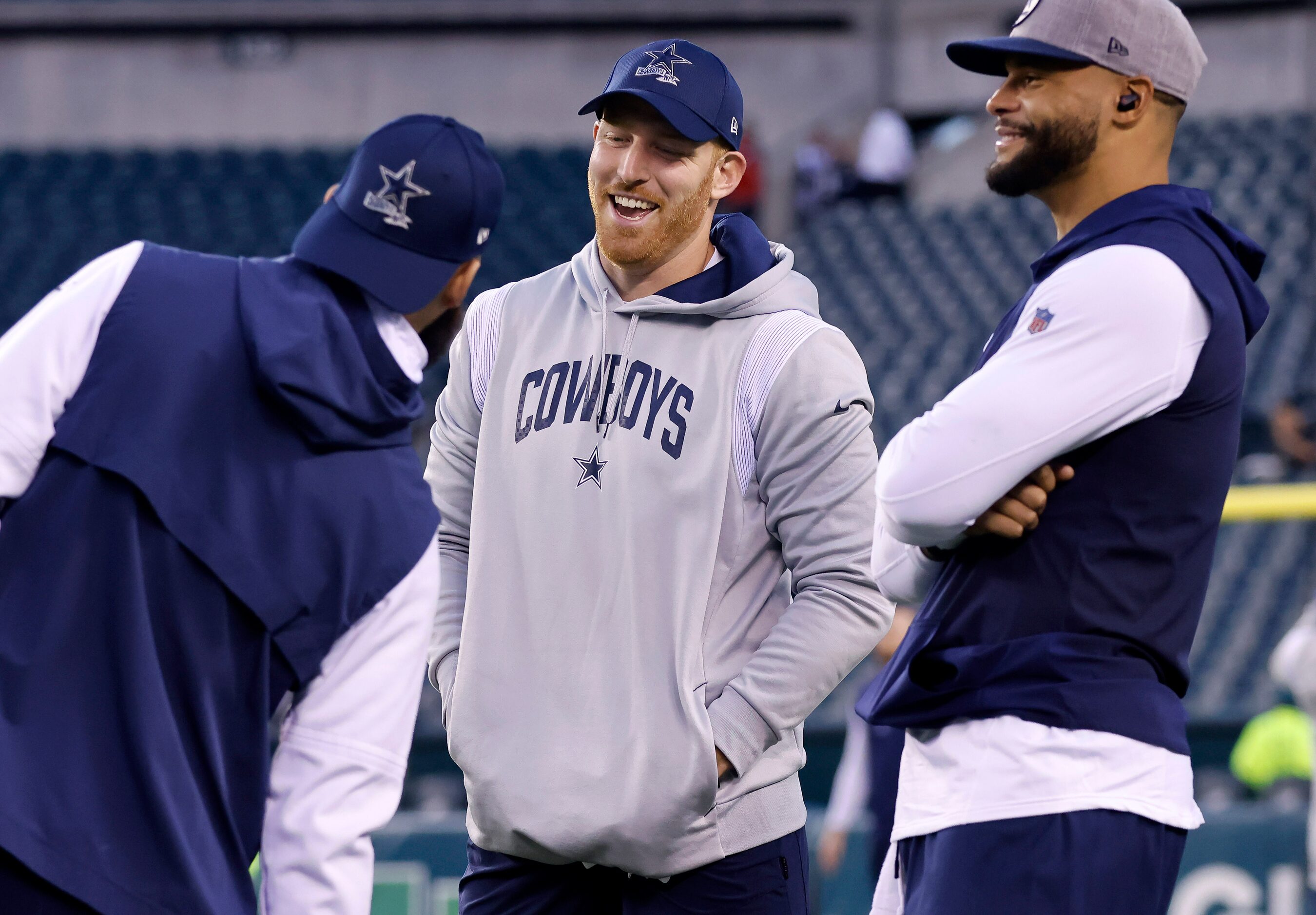 Dallas Cowboys quarterbacks Will Grier (left) Cooper Rush (center) and Dak Prescott visit...