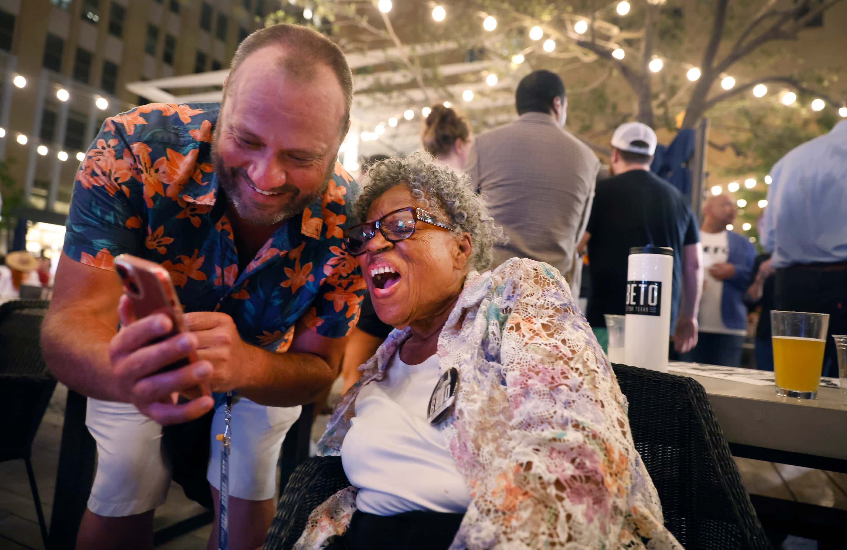 Grandmother of Juneteenth, Opal Lee (right) looks at Steve Fox’s photos of his son at the...