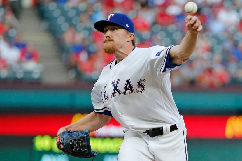Texas Rangers relief pitcher Jake Diekman (41) throws a ninth-inning pitch during the...