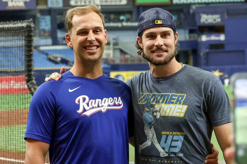 Texas Rangers' Nathaniel Lowe, left, and his brother Tampa Bay Rays' Josh Lowe pose for...
