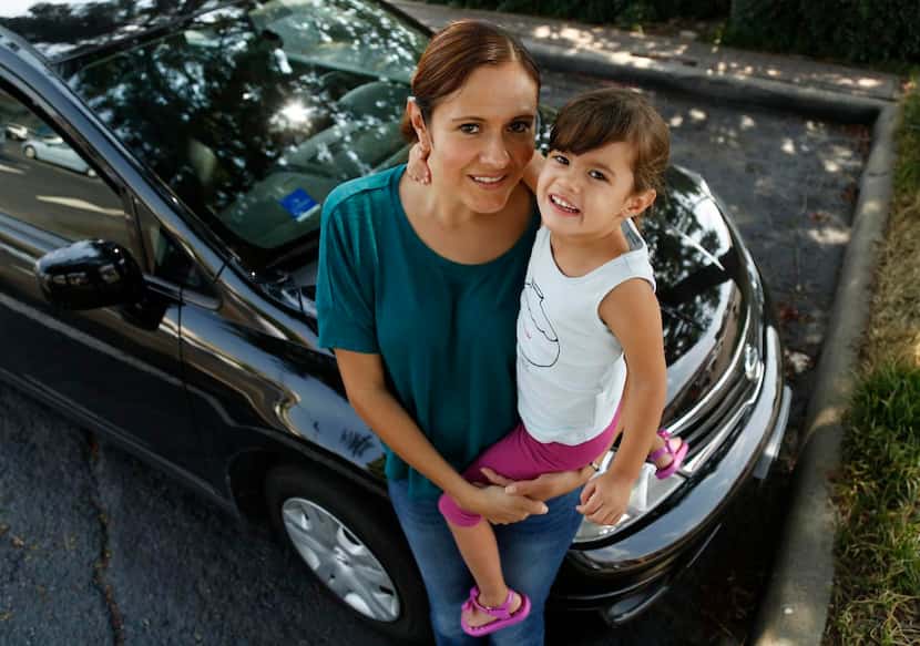 
Waitress Yasmin Flores, with her daughter, Yvette, says her car frees her from a bus that...