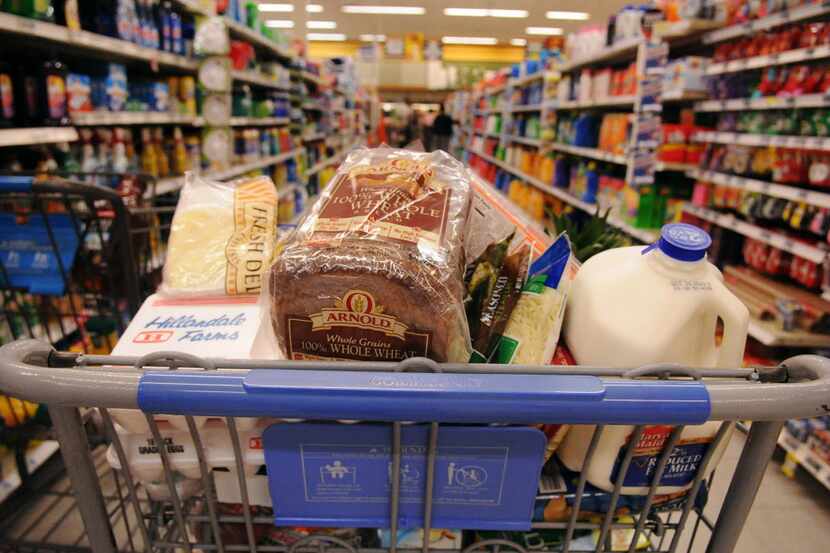 This photo shows a packed shopping cart in an aisle at the Fort Lee, Va. Commissary on...