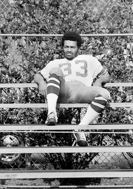 Dallas Cowboys running back Duane Thomas sits along on bleachers at training camp in New...