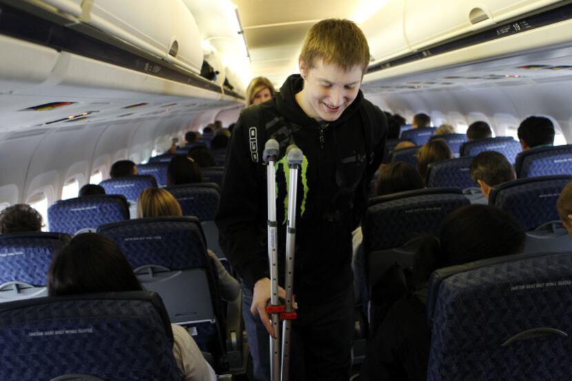 At DFW Intl. Airport, Connor Perry and other amputee patients from Texas Scottish Rite...