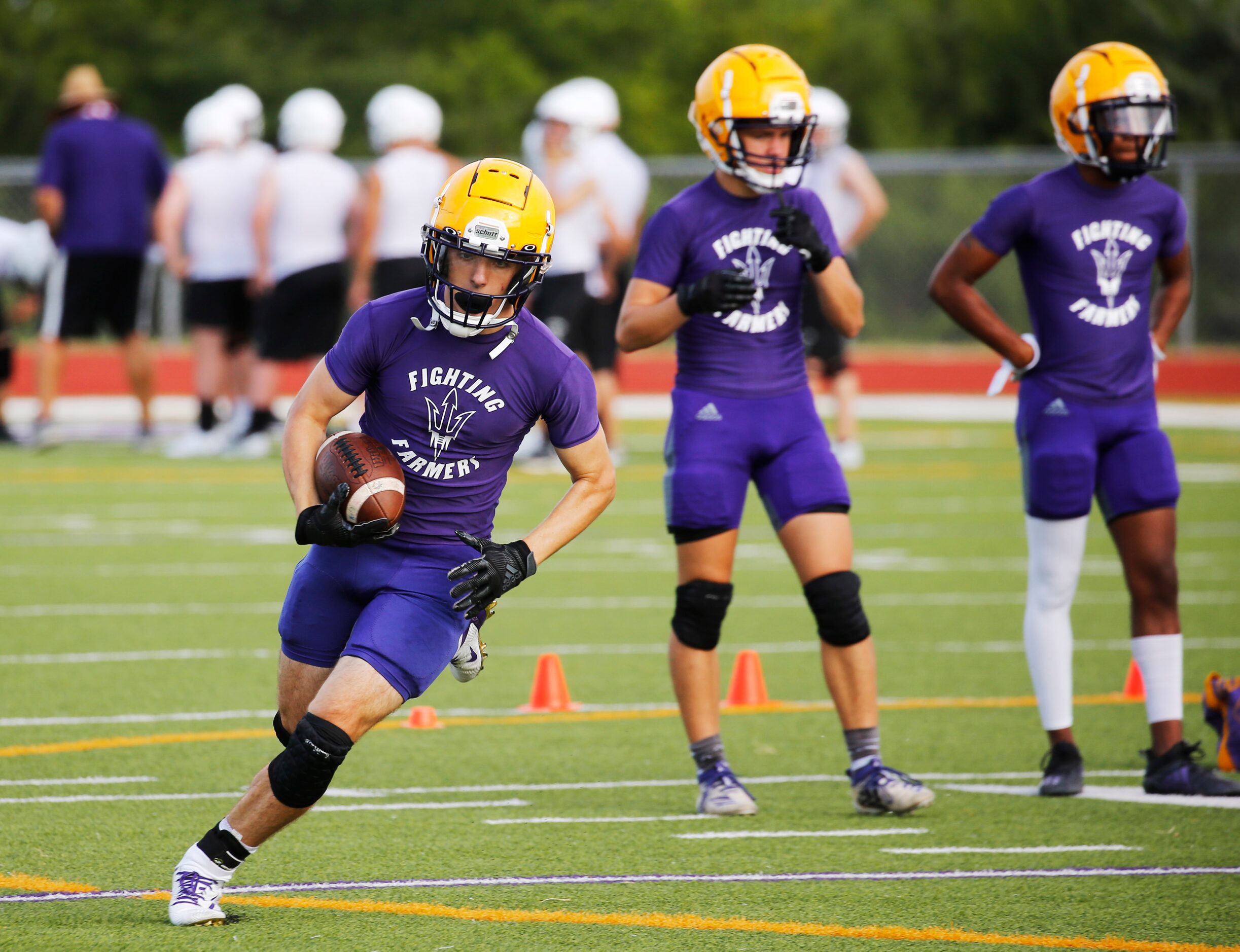 Farmersville's Braden Lair runs up the field after the catch during the first day of high...