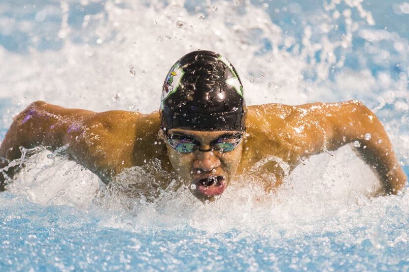 Southlake Carroll's Jack LeVant swims in the boys 100-yard butterfly final during the UIL...