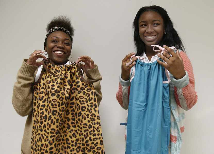 
Ninth-graders Rikkia Davis (left) and Rakeadra Closure show dresses they made from...