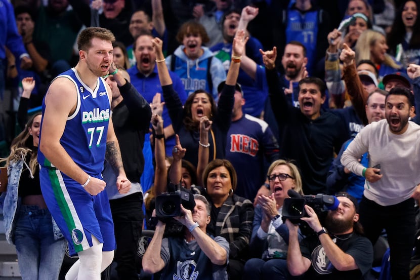 Dallas Mavericks guard Luka Doncic (77) flexes after making a basket during the second half...