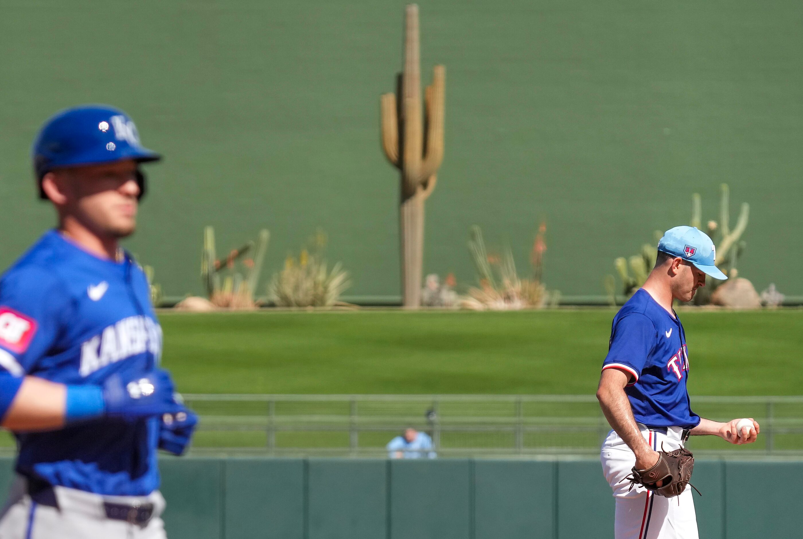 Texas Rangers pitcher Cody Bradford gets a new ball after a home run by Kansas City Royals...