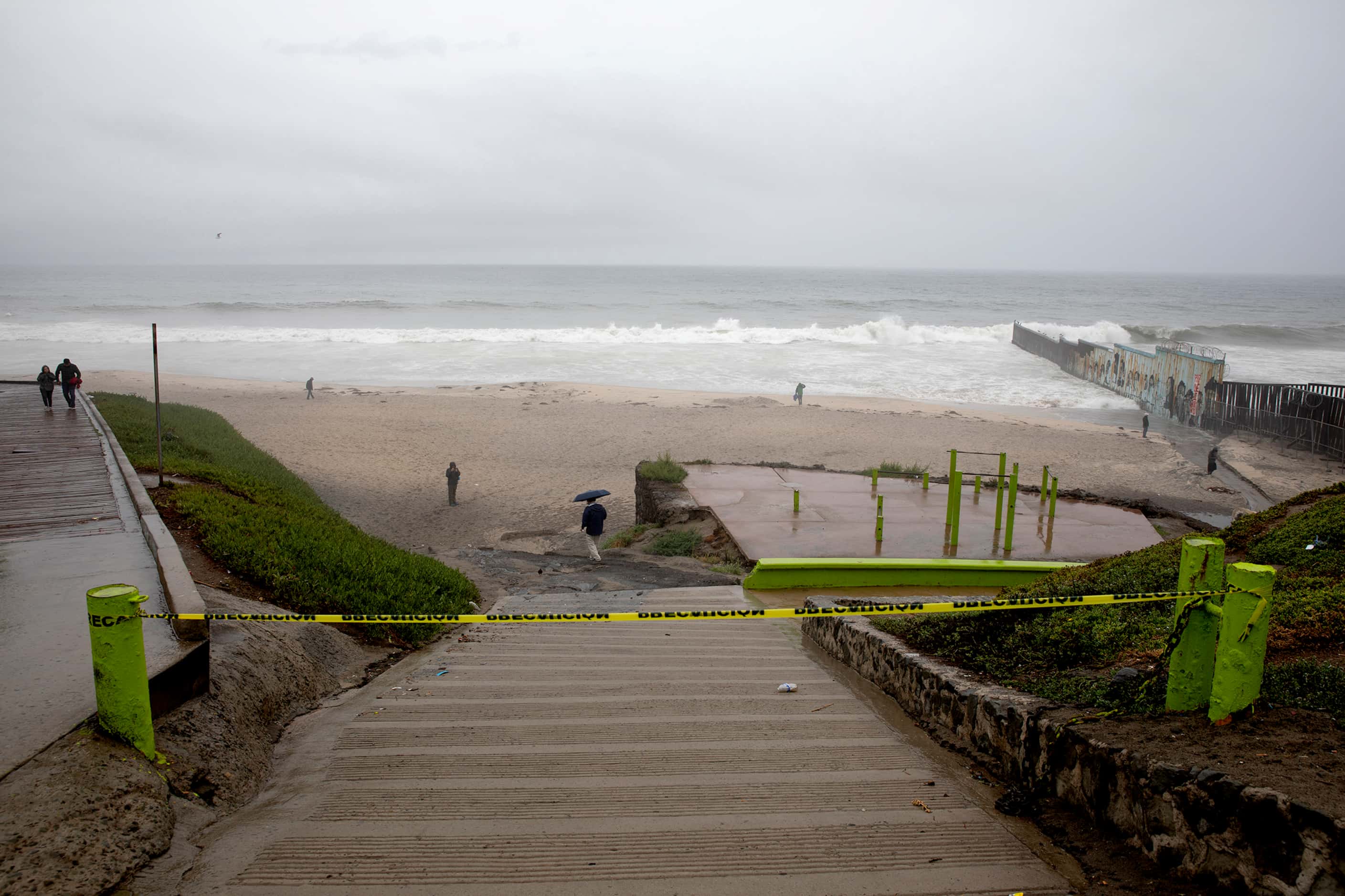 People ignore caution signs for beach closings at Las Playas de Tijuana as Tropical Storm...