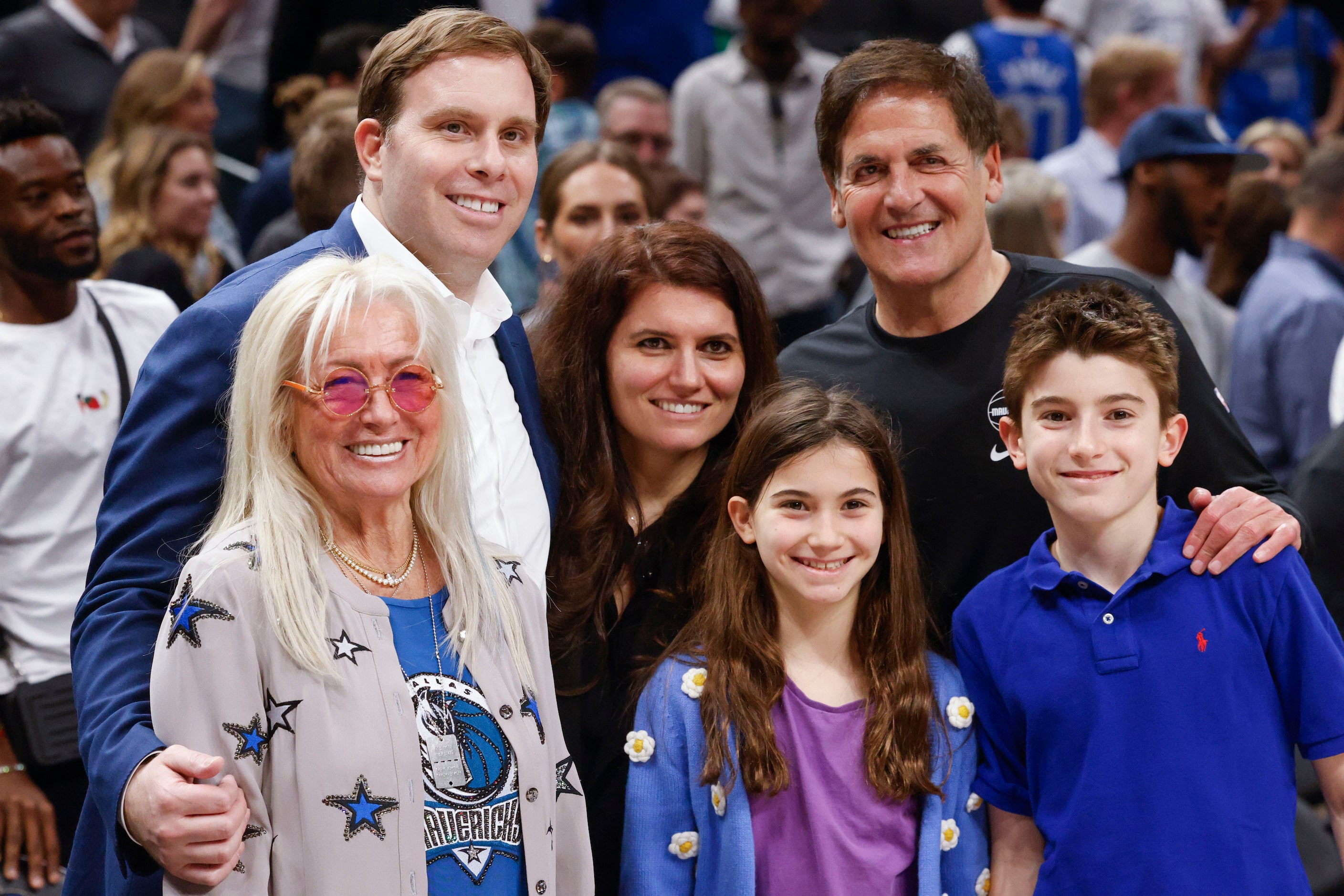 Dallas Mavericks Governor Patrick Dumont (left back), pose a photo with his mother-in-law,...