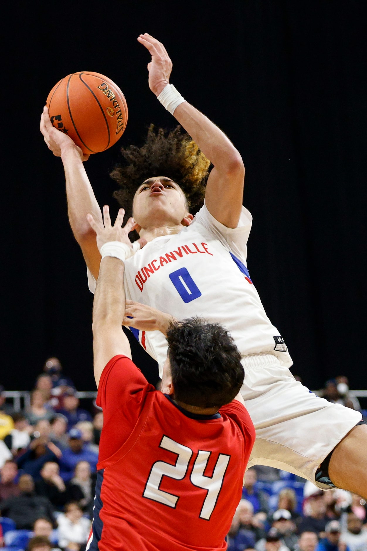 Duncanville guard Anthony Black (0) launches a shot over Humble Atascocita guard David...