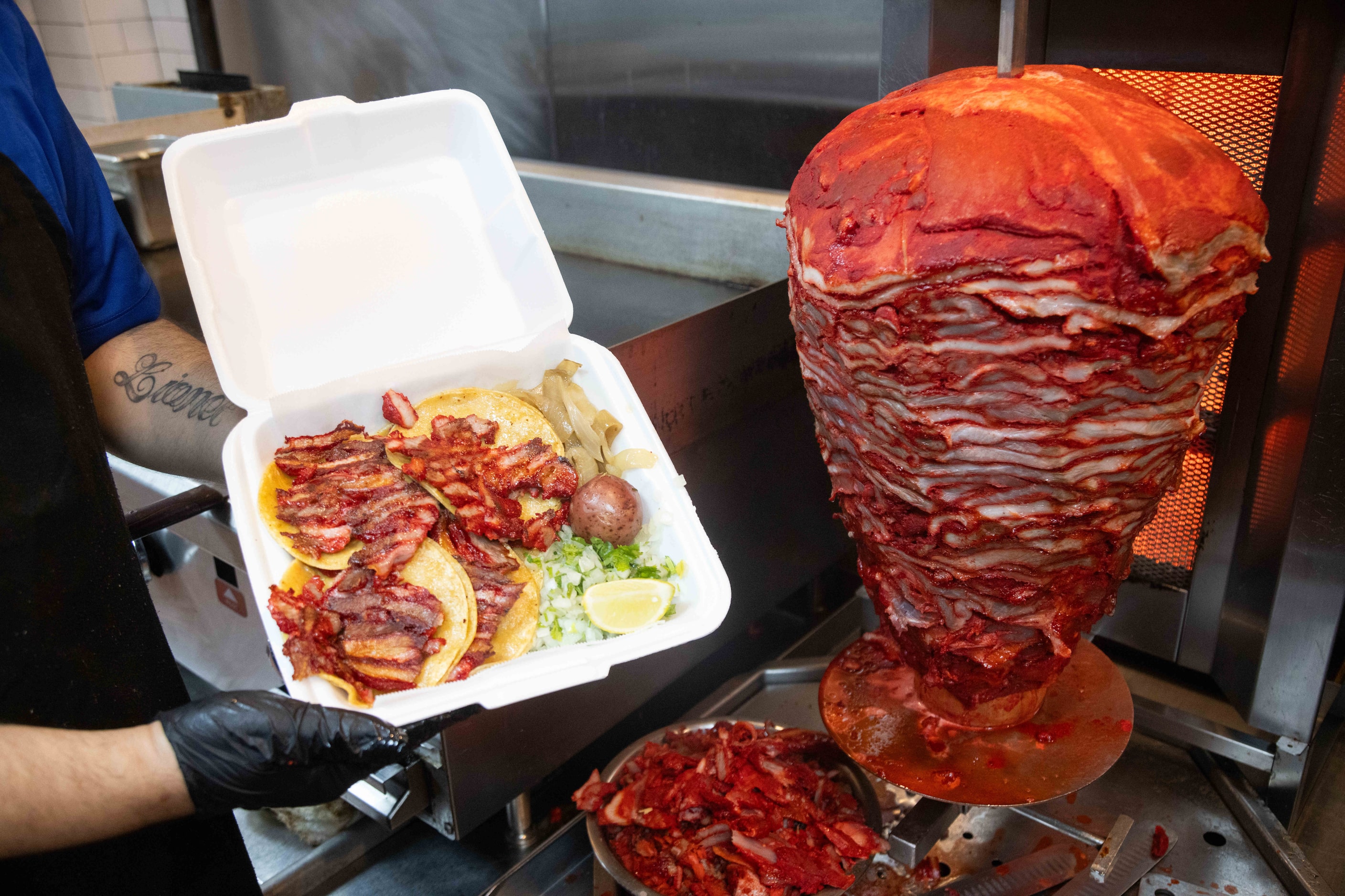 José “Joe” Reyna boxes up trompo tacos at Taco Rey (Polkmart). A single trompo, shown to the...