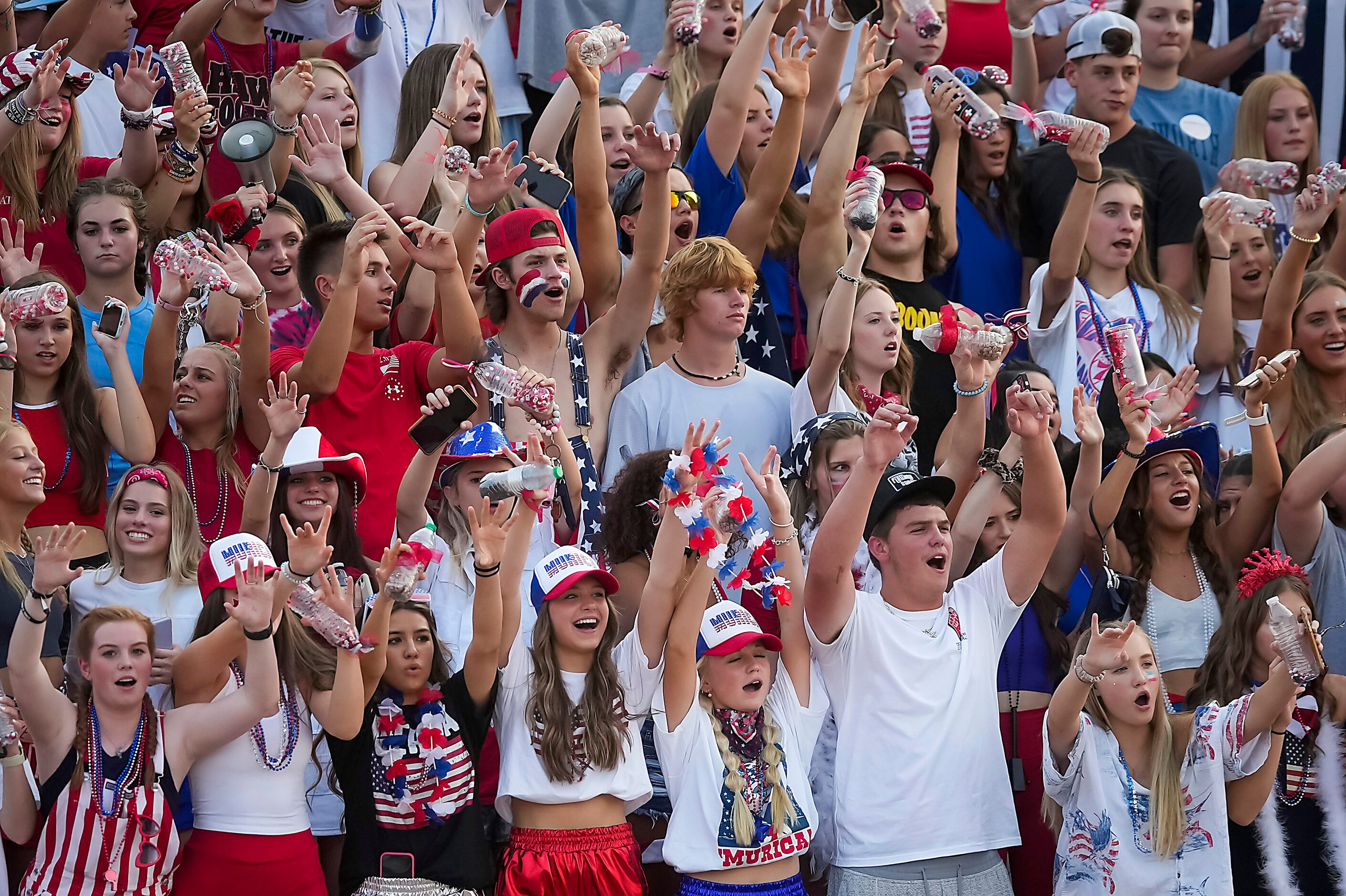 Rockwall-Heath students celebrate a Hawks touchdown during the first half of a high school...