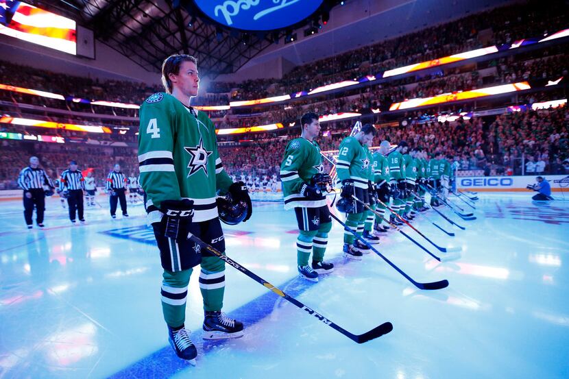 Dallas Stars defenseman Miro Heiskanen (4) lines up for the national anthem during the...