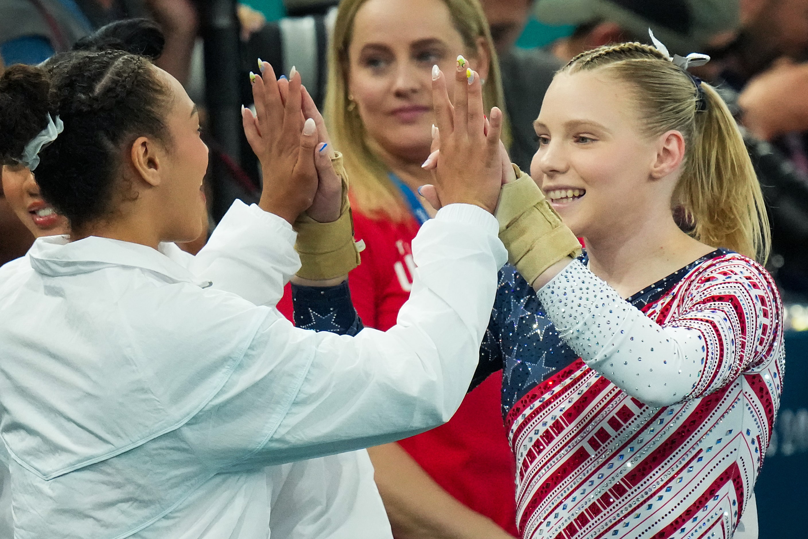 Jade Carey of the United States (right) celebrates with teammate Hezly Rivera after...