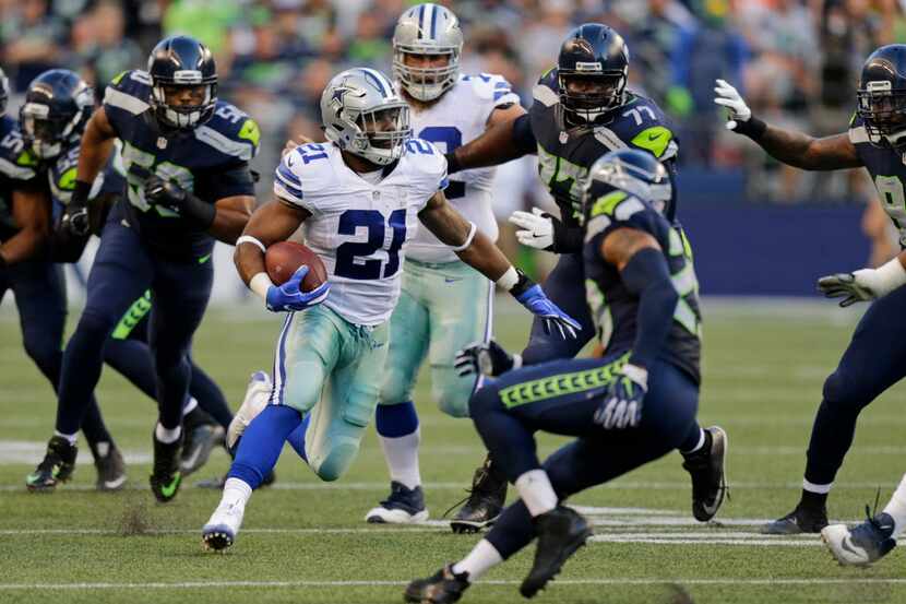 Dallas Cowboys running back Ezekiel Elliott (21) rushes against the Seattle Seahawks in the...
