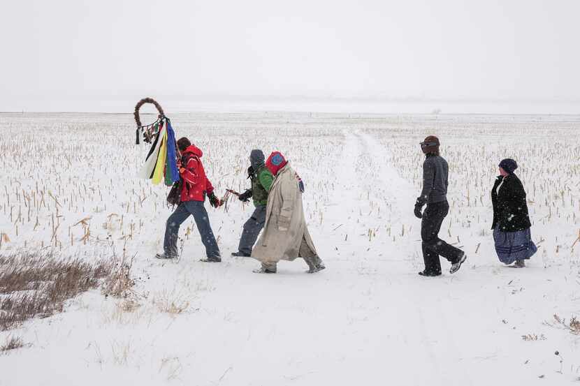 "Standing Rock Prayer Walk, North Dakota 2018" is among the photographs featured in "Mitch...
