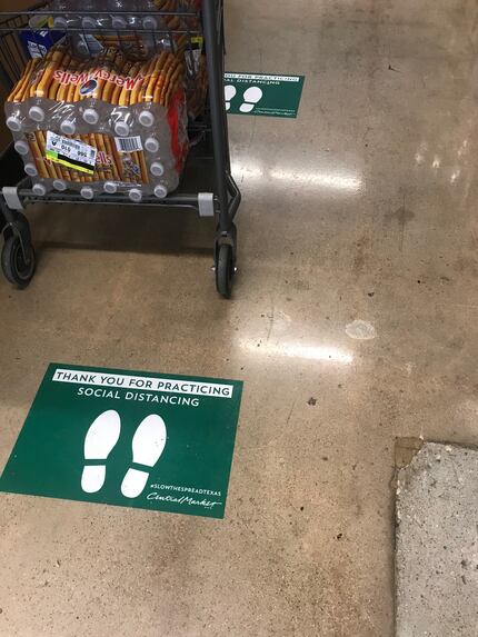 Central Market and H-E-B stores in Texas have added decals on the floor to remind shoppers...