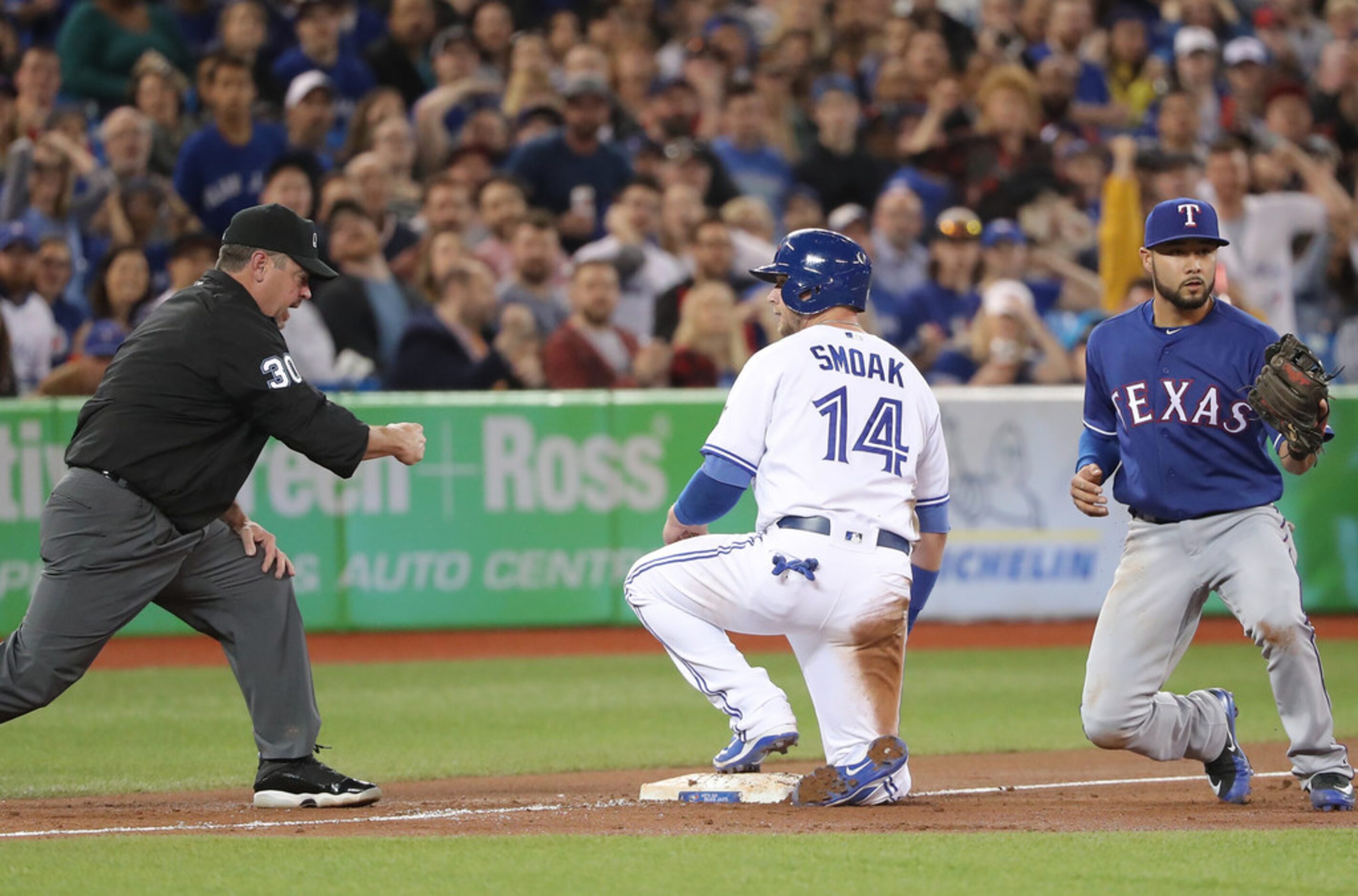 TORONTO, ON - APRIL 27: Justin Smoak #14 of the Toronto Blue Jays is throw out trying...