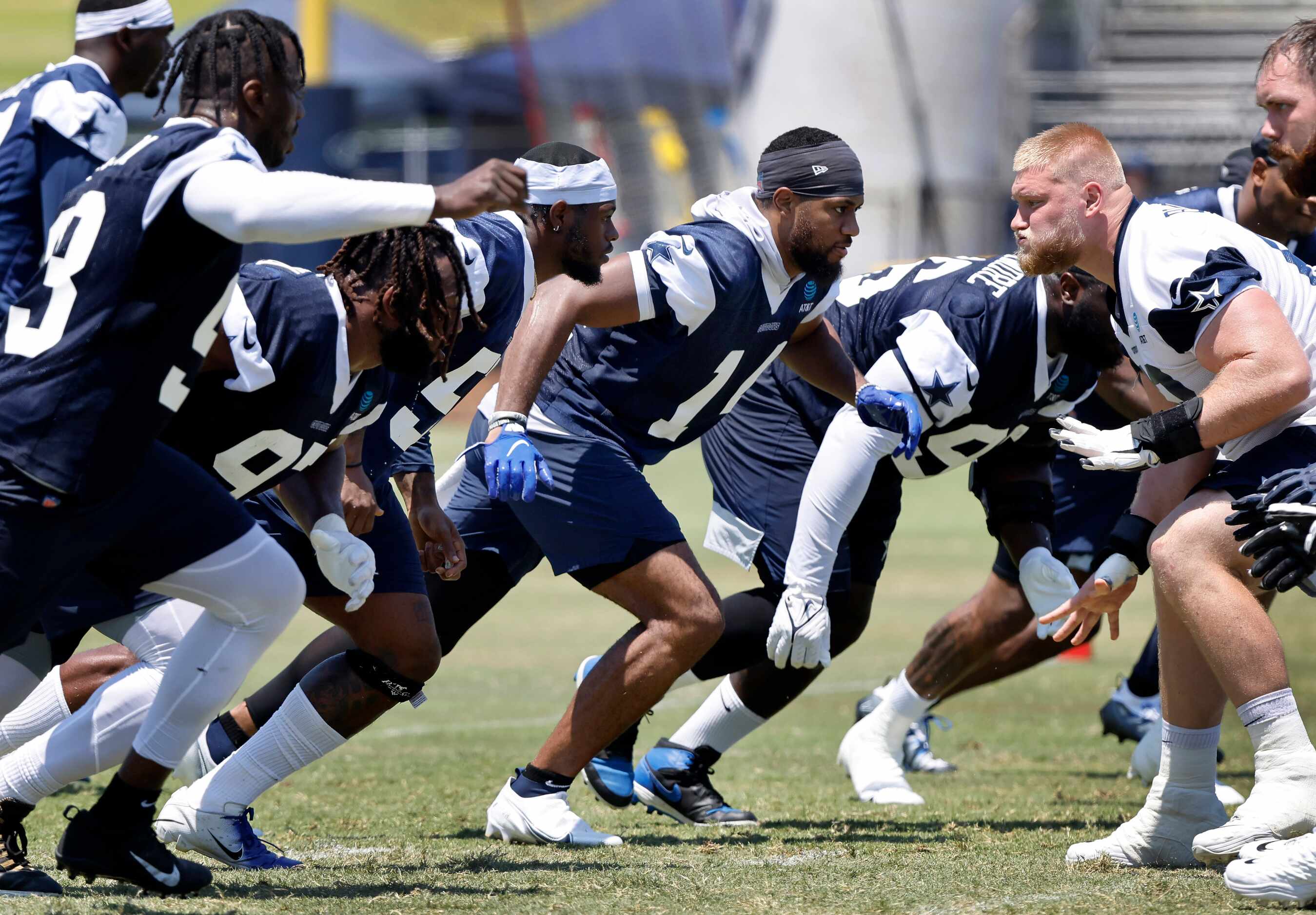 Dallas Cowboys linebacker Jabril Cox (14, center) bursts off the line during a walk-thru...