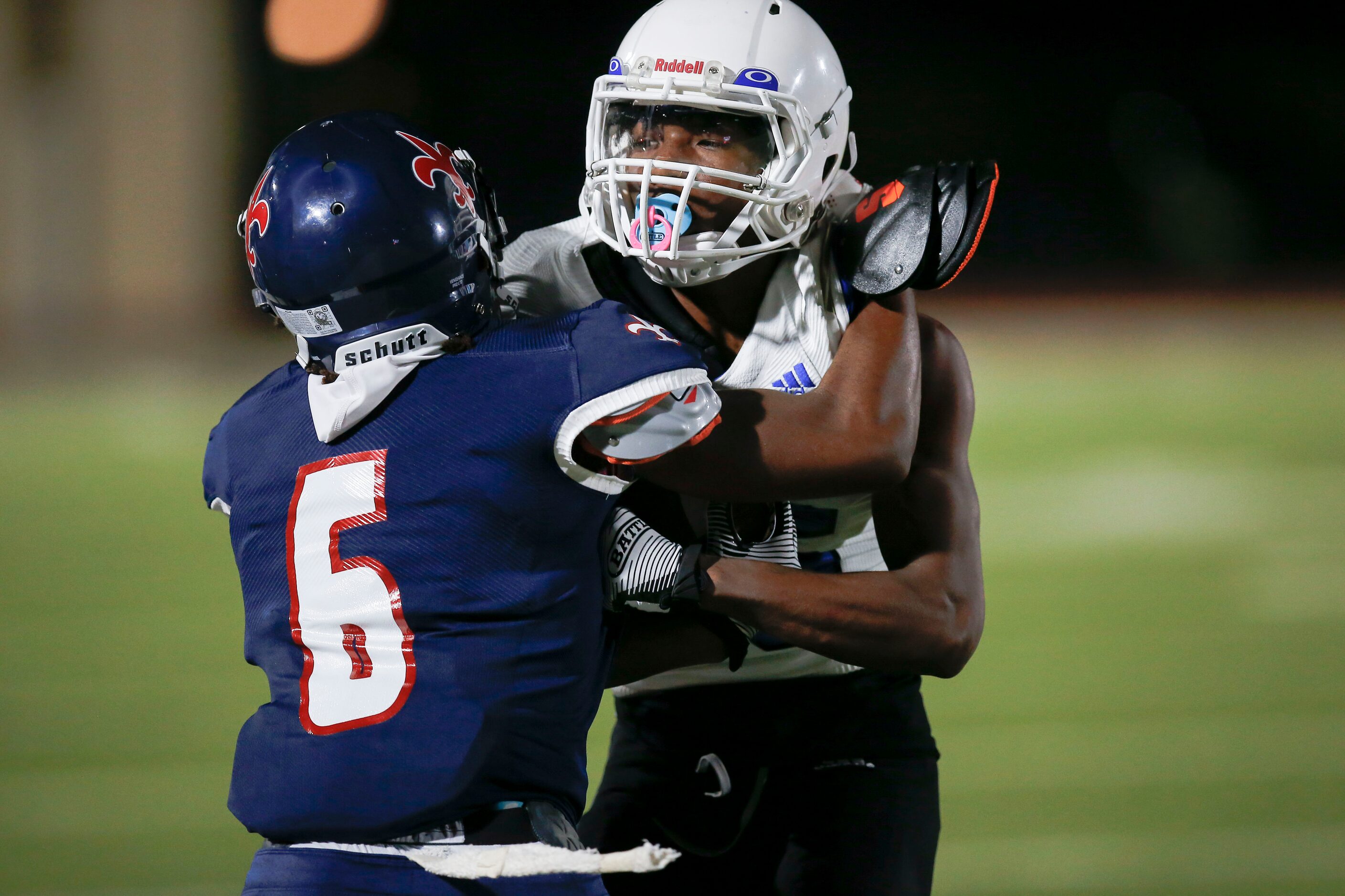 Kimball senior safety Jaylan Martin (6) forces Conrad senior Tony King ouf of bounds during...