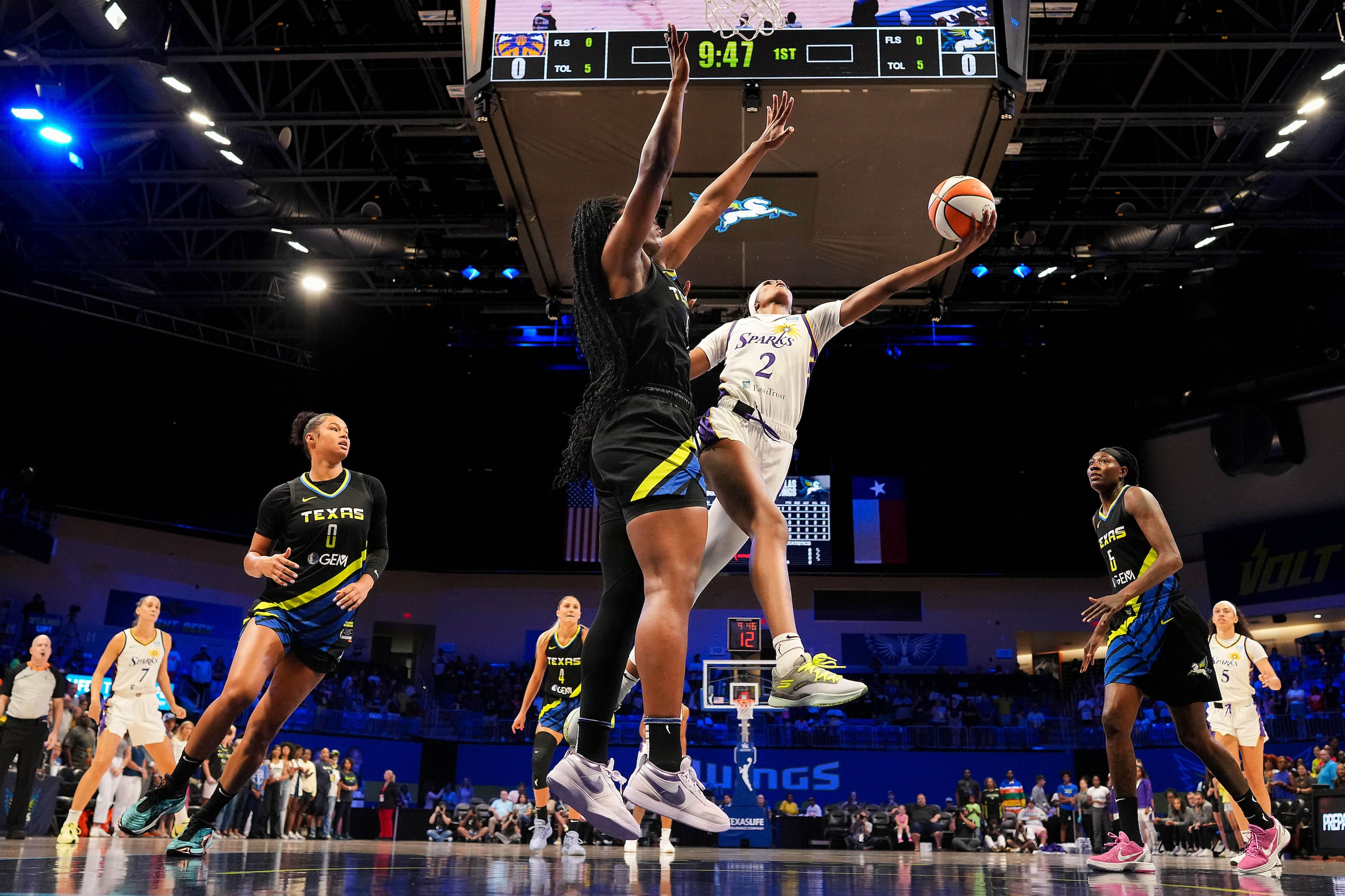 Los Angeles Sparks forward Rickea Jackson (2) scores past Dallas Wings center Teaira McCowan...