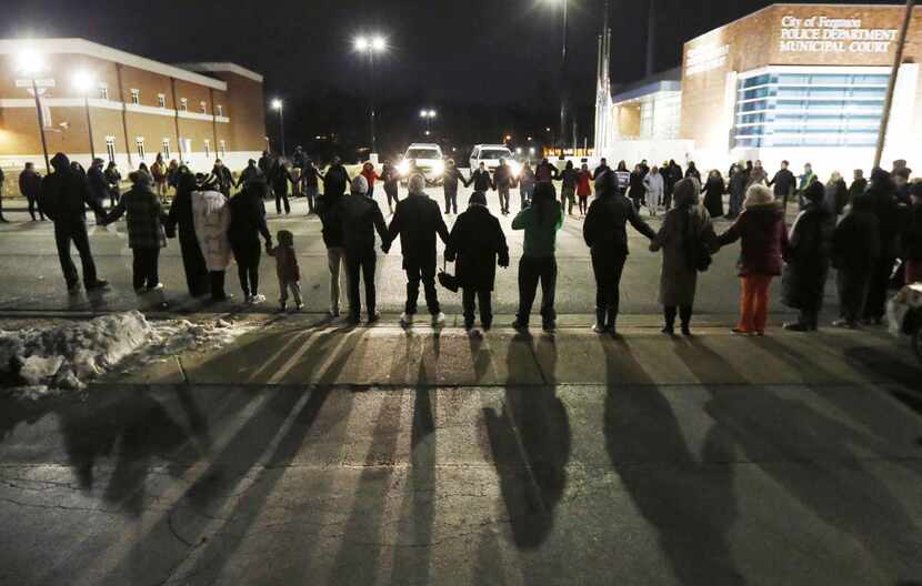 
Protesters blocked traffic outside the Ferguson, Mo., police station on Wednesday after the...