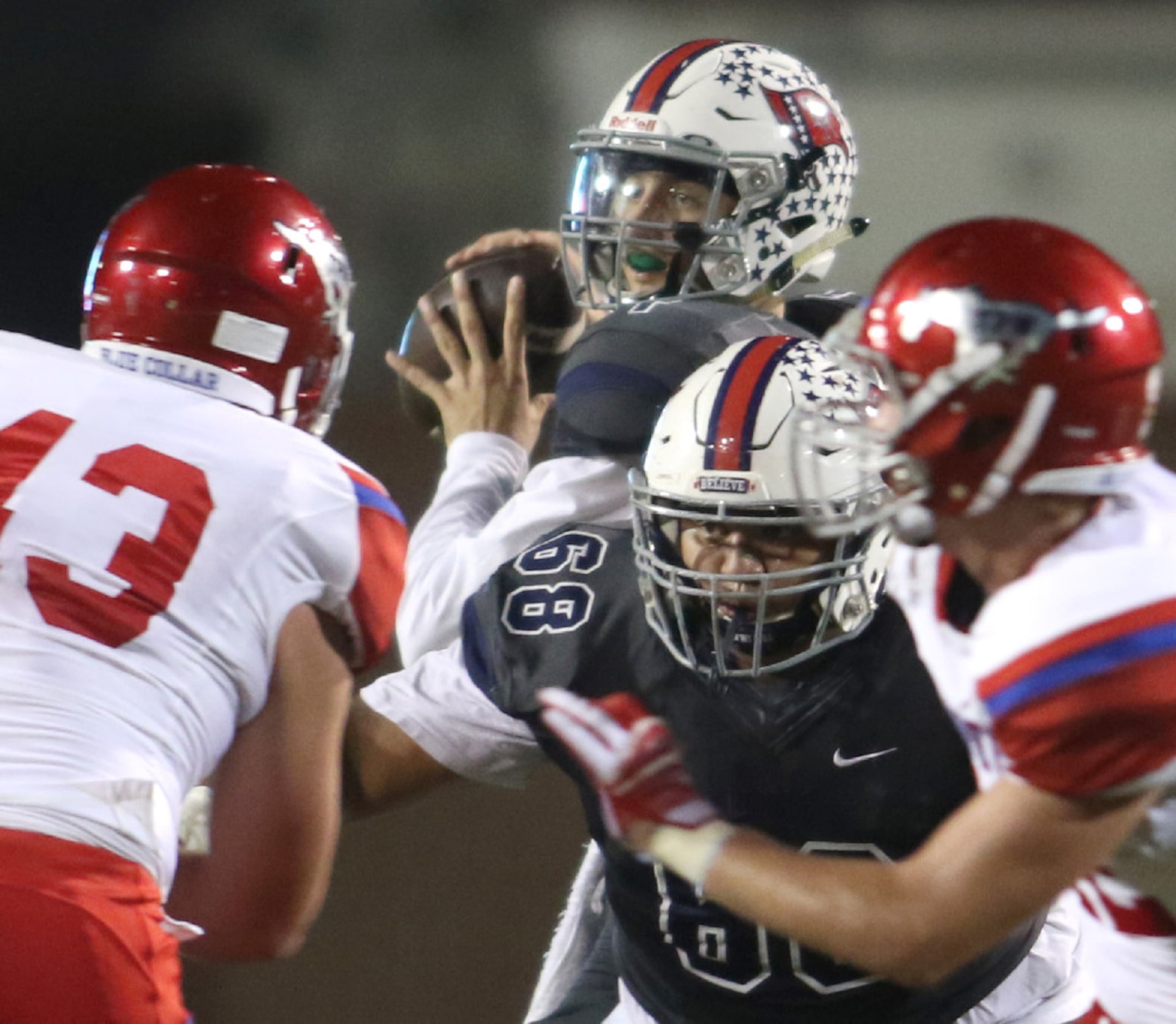 Richland quarterback Trae Self (1) looks to pass downfield during first half action against...