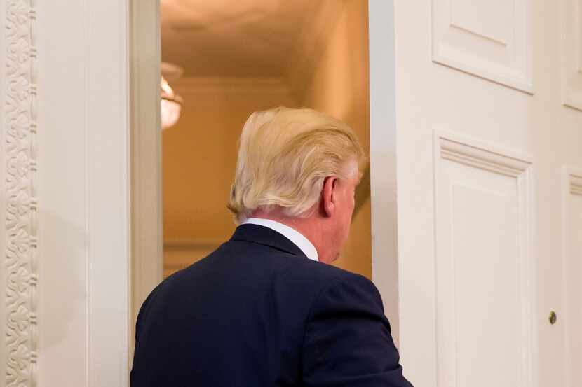 President Donald Trump unexpectedly left the Oval Office on Friday, where he was to sign two...