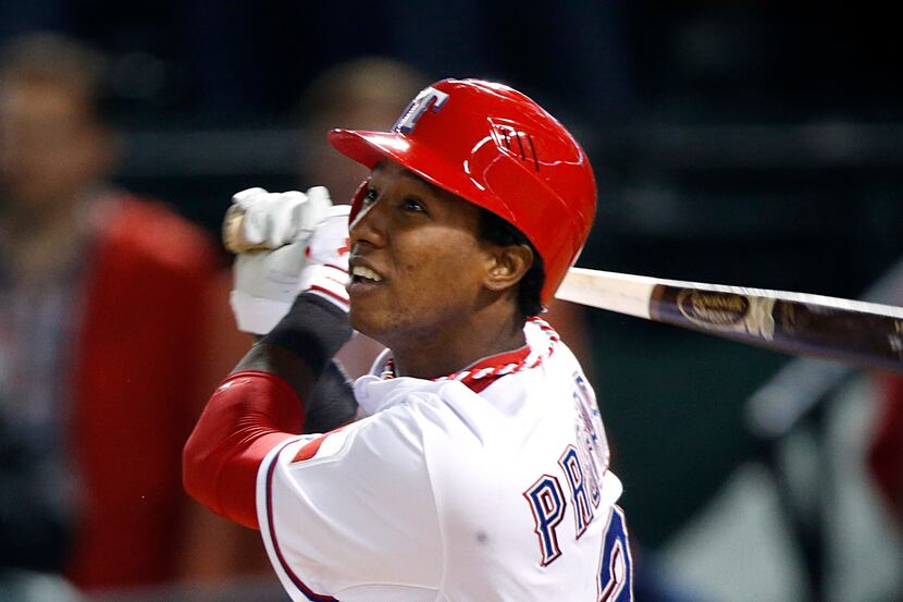 Texas Rangers shortstop Jurickson Profar (2) watches his ninth inning single load up the...