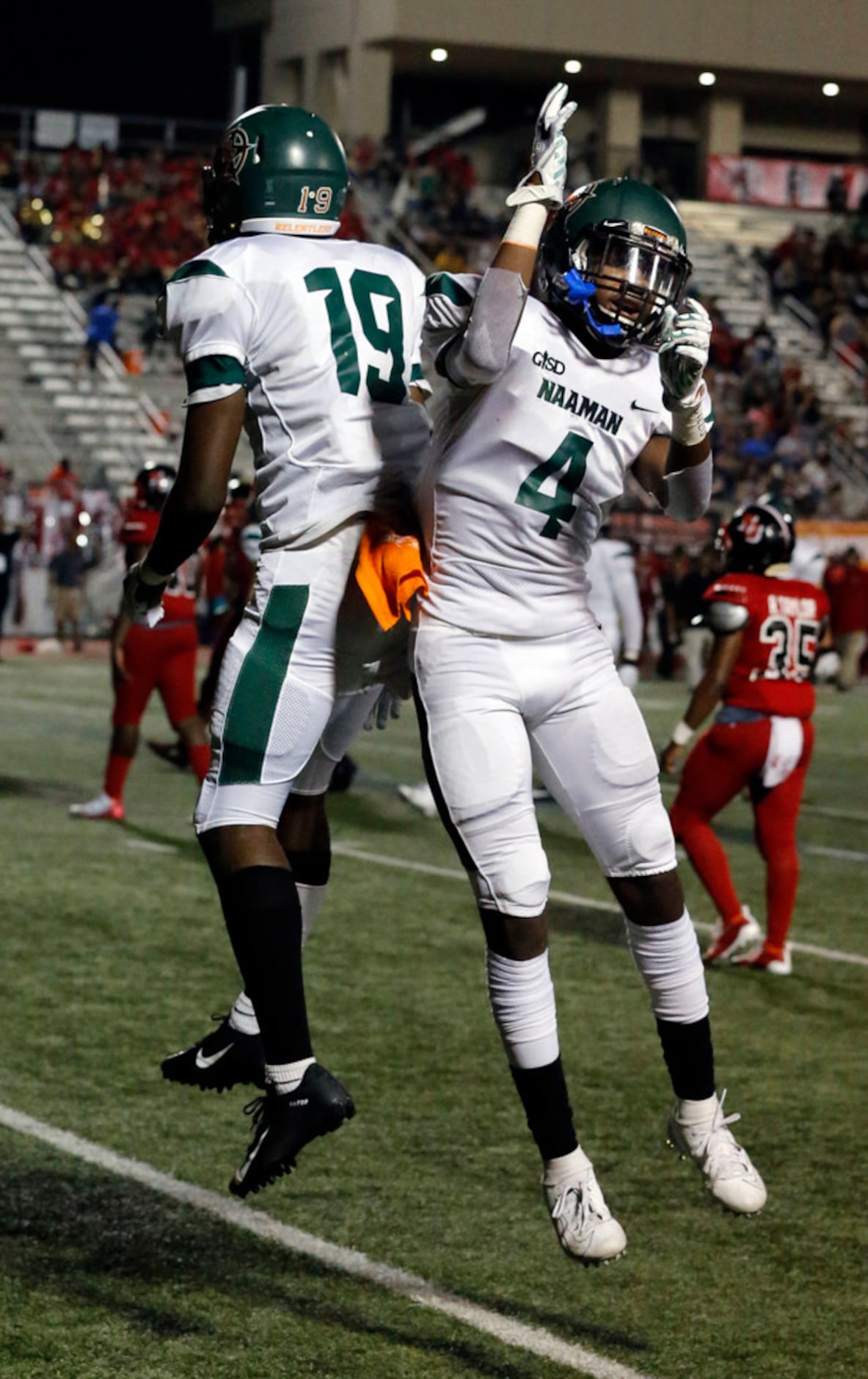 Naaman Forest WR Bryson Huey (19) and QB Clayton Thompson (4) celebrate after Huey's...