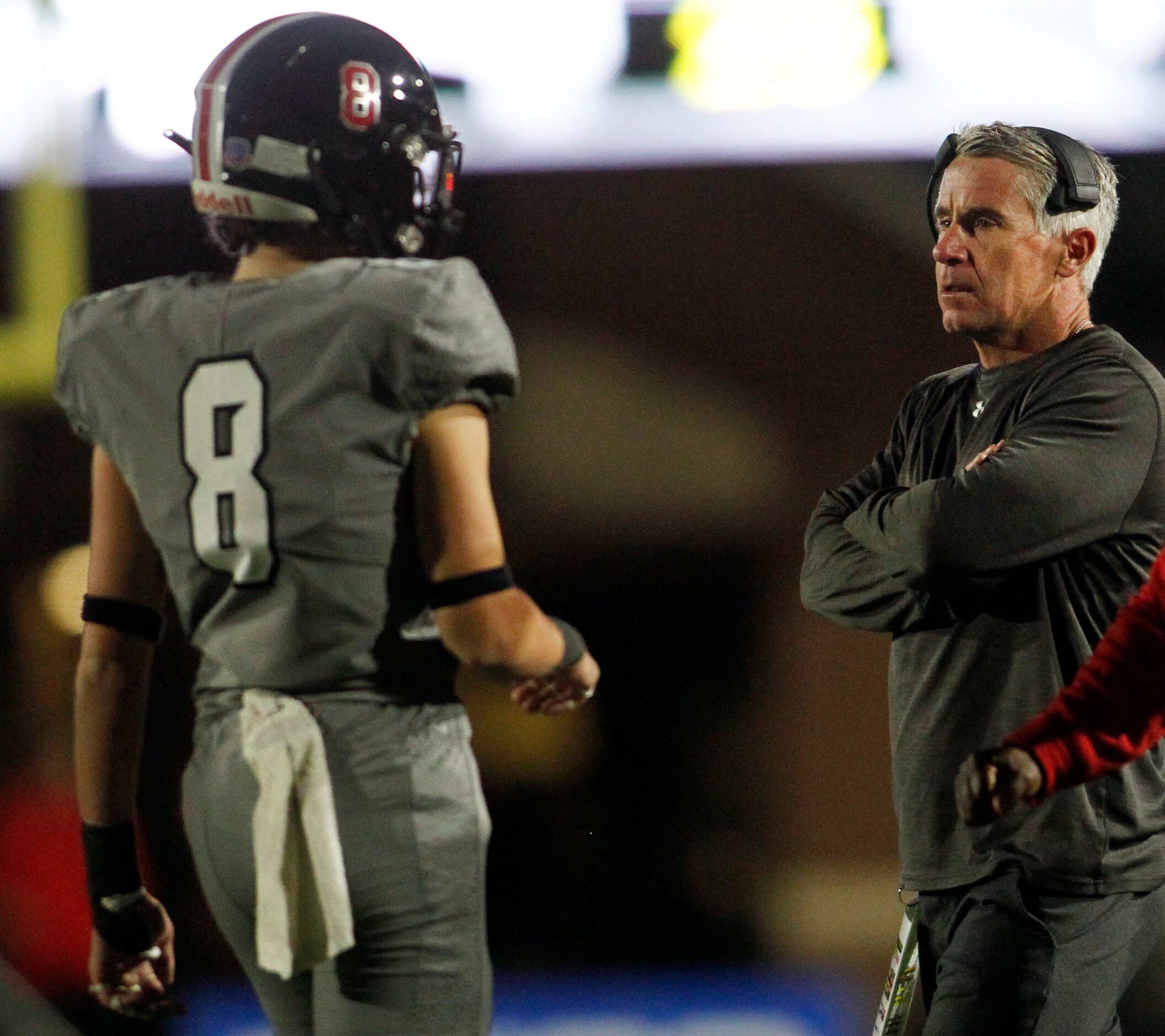 Lucas Lovejoy defensive coordinator Jason Johns speaks with Leopard defensive back Adam...