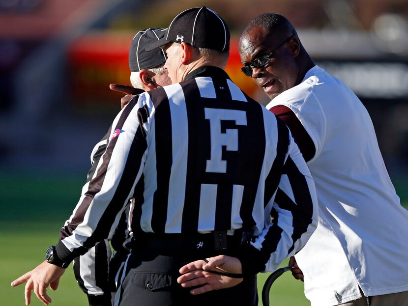 Texas State coach Everett Withers, right, argues with the officials during the first half of...