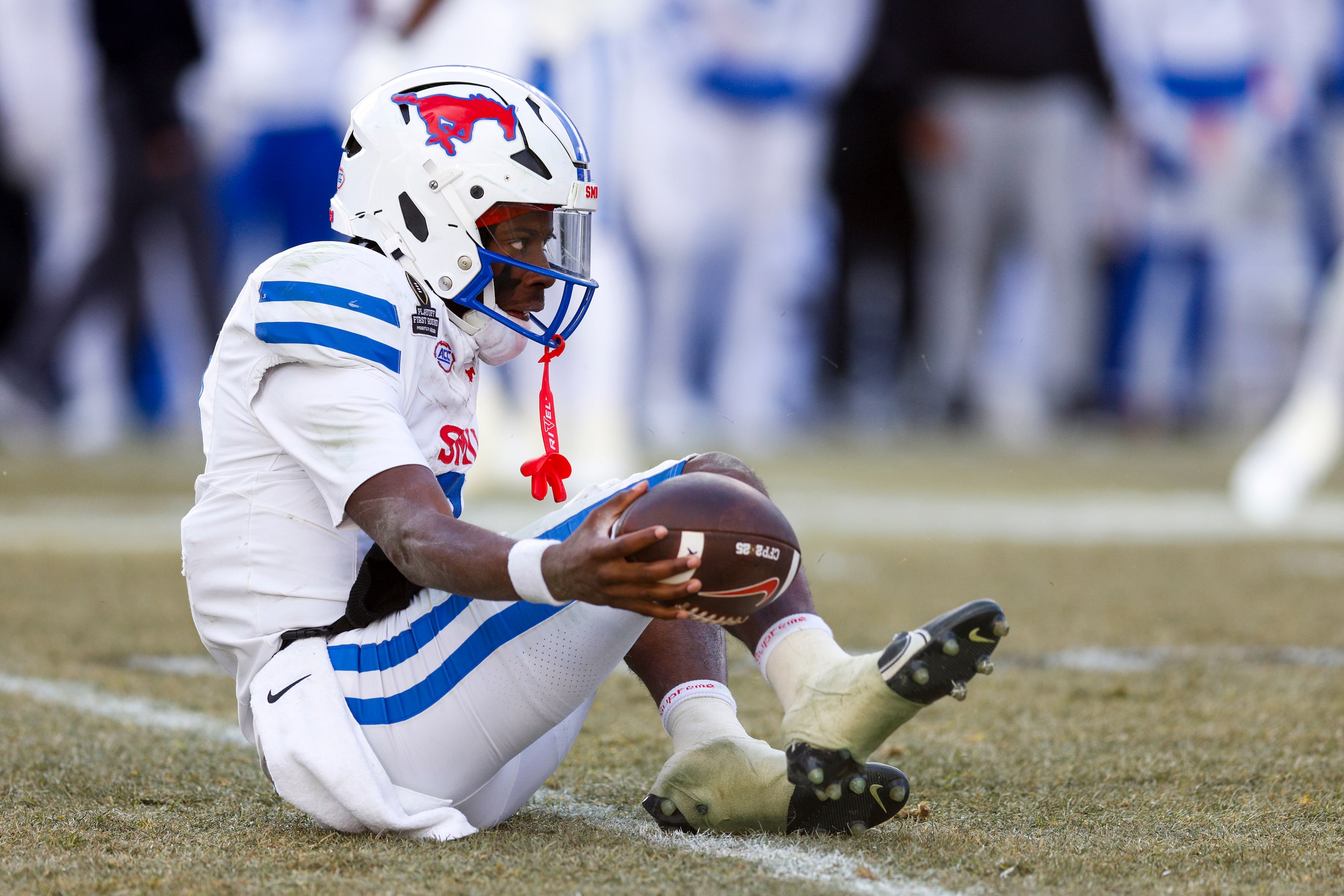 SMU quarterback Kevin Jennings (7) gets up after being tackled during the second half of a...