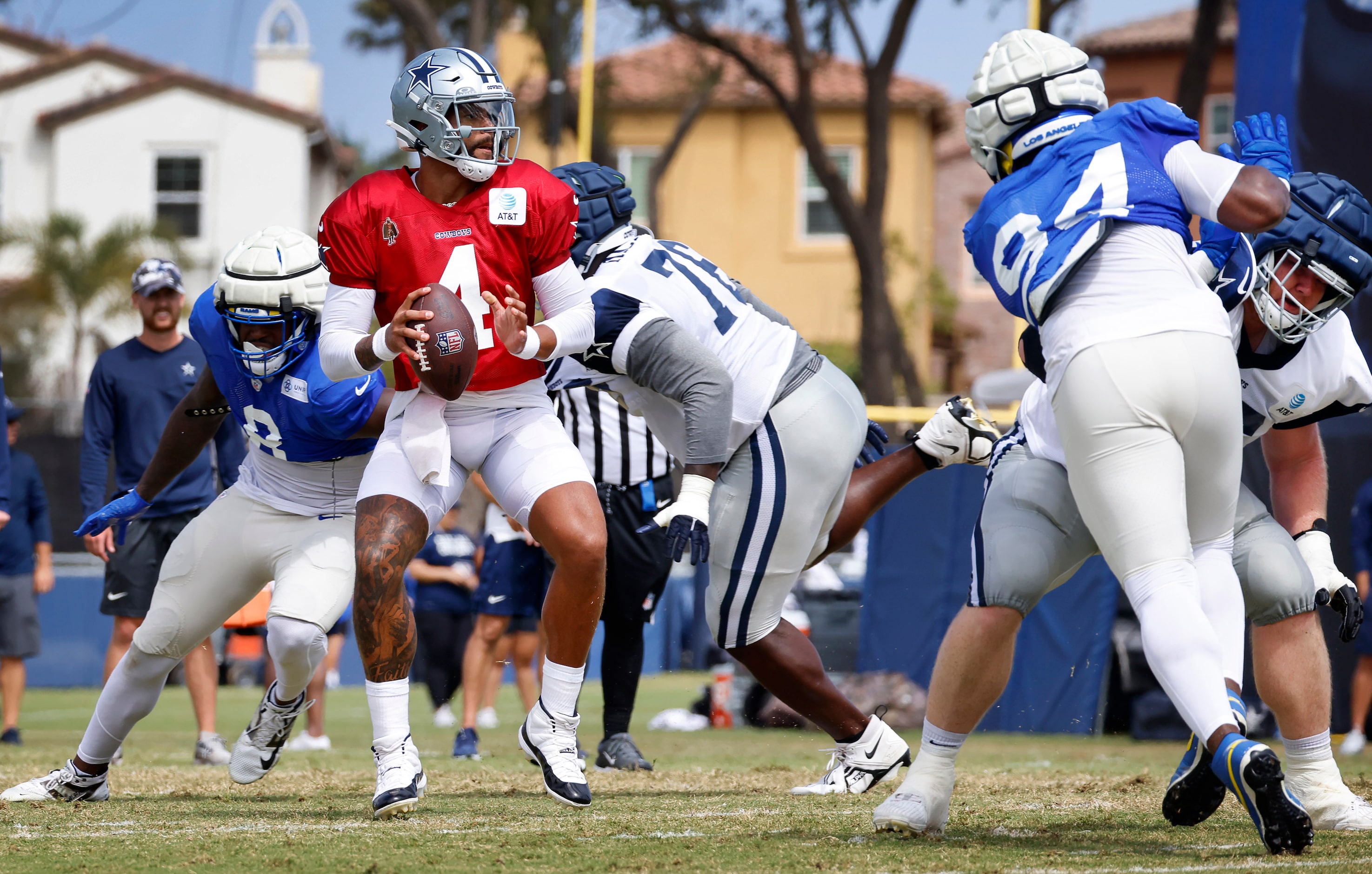 Dallas Cowboys quarterback Dak Prescott (4) drops back to pass against the Los Angeles Rams...