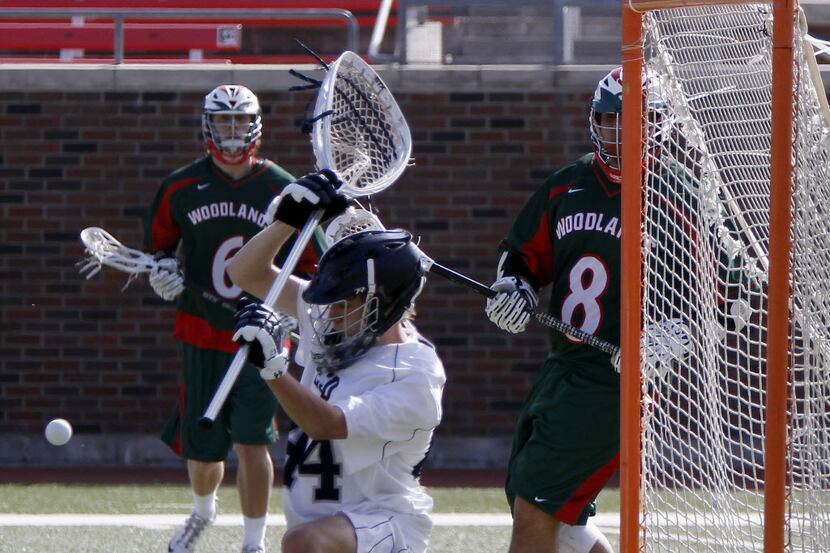 Episcopal School of Dallas goal keeper Charlie Spikes (44) makes a save as the ball bounces...