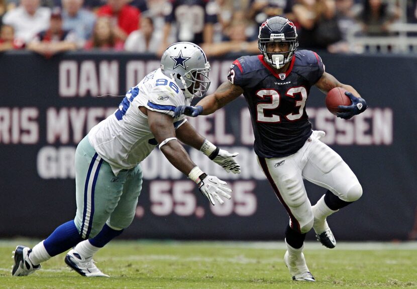 Dallas Cowboys defensive end Marcus Spears (96) tries to stop Houston Texans running back...