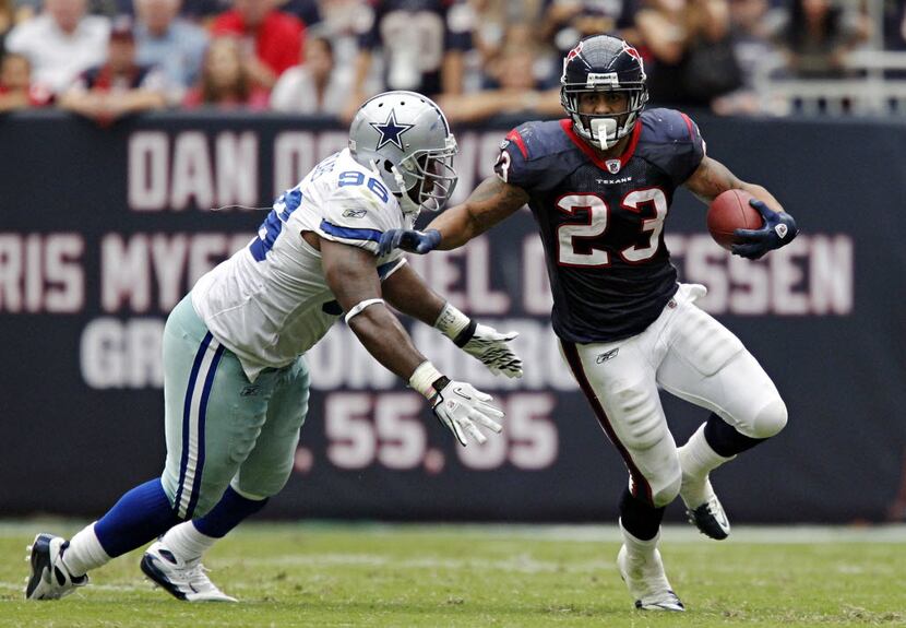 Dallas Cowboys defensive end Marcus Spears (96) tries to stop Houston Texans running back...
