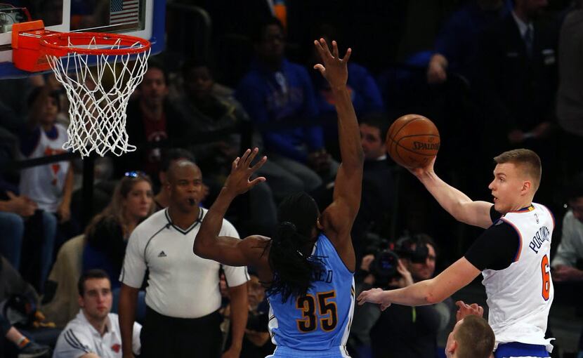 Denver Nuggets forward Kenneth Faried (35) defends against New York Knicks forward Kristaps...