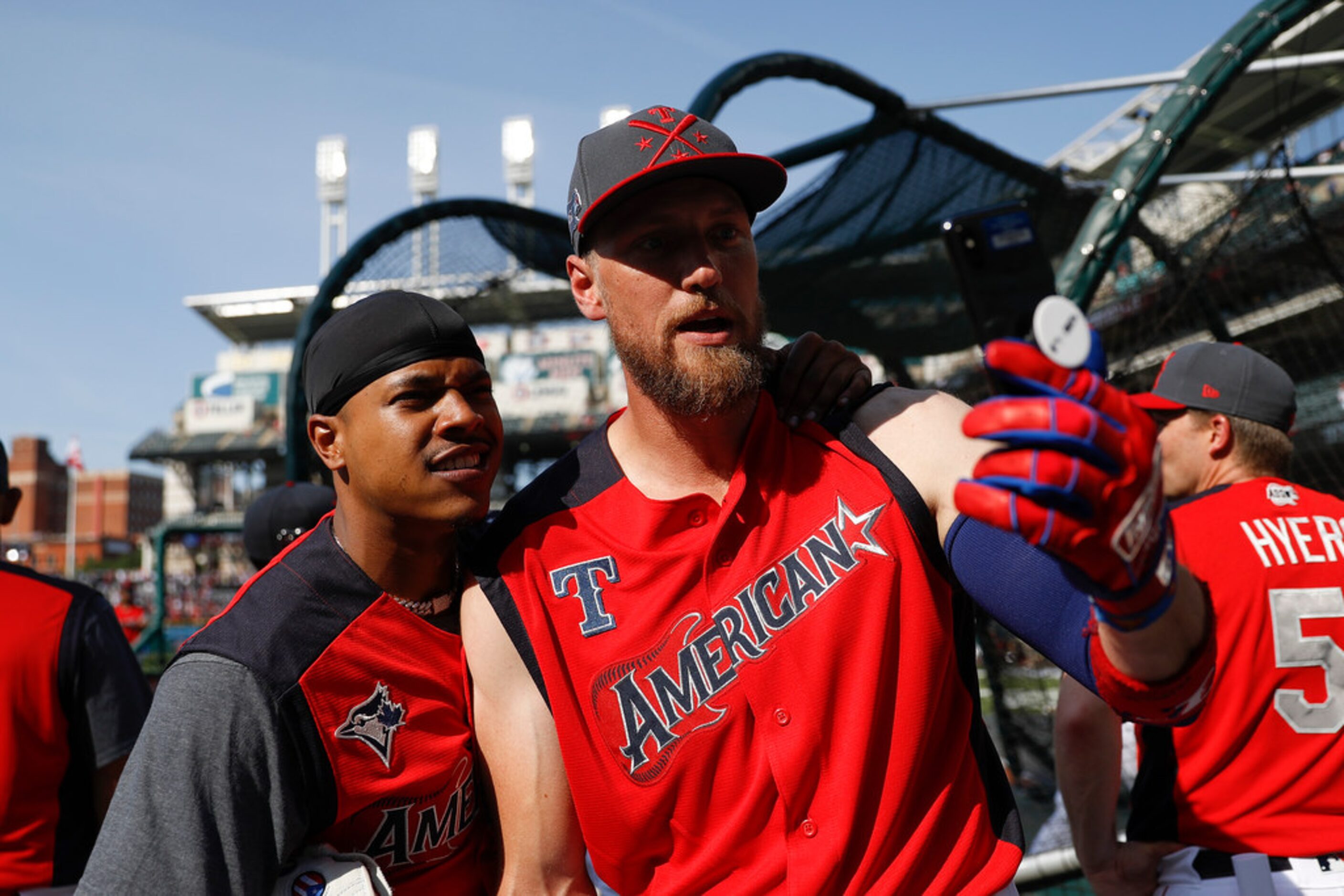 Marcus Stroman, of the Toronto Blue Jays, and Hunter Pence, of the Texas Rangers, pose for a...