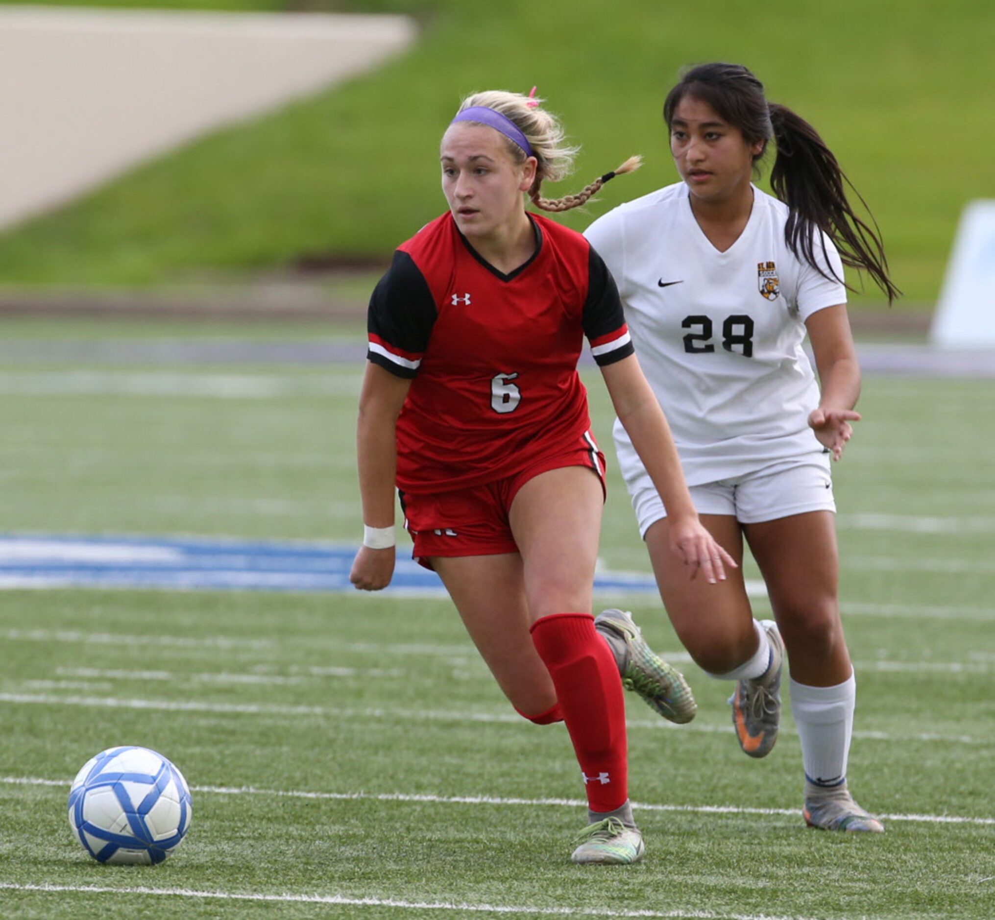 Ursuline Academys Alyssa DAloise (6) races for the ball against St. Agnes Academys Megan...